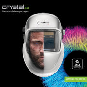 Optrel Crystal 2.0 welding helmet promotional image showing a welder's split face through the lens to illustrate true-color perception.